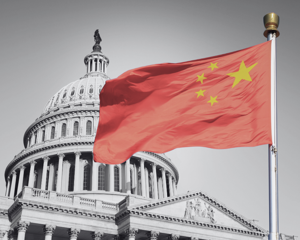 Chinese flag flying in front of the United States Capitol
